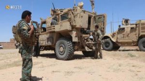 Deir ez-Zor – SDF fighter beside Global Coalition vehicles – North Press