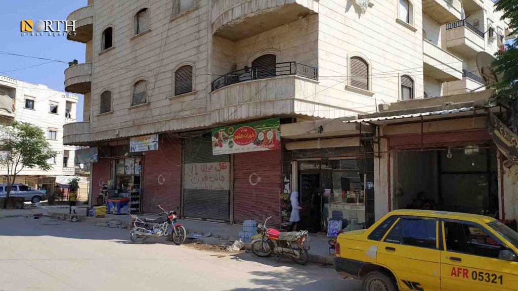 Storefronts painted with the Turkish flag in Afrin – (Photo: North Press)