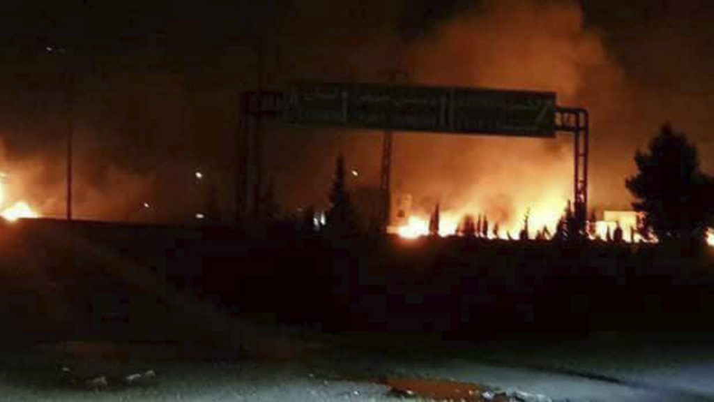 Flames rise after an attack in Kisweh, south of Damascus, Syria (Credit: AP/Press Association Images)