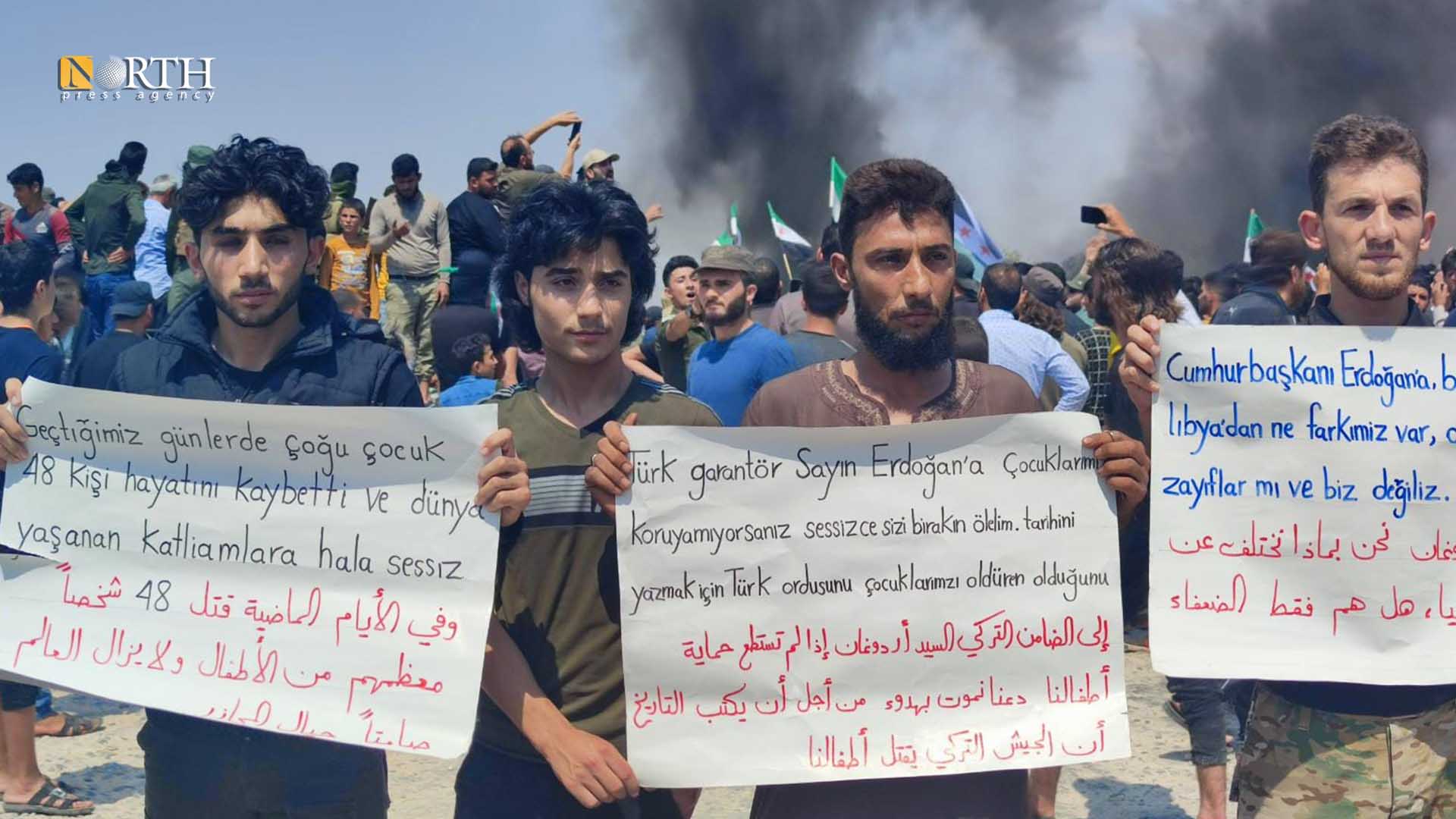 Residents protest in front of the Turkish post, Friday, in the town of Mu'taram, south of Idlib- North Press