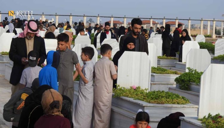 Children visit the graves of their fathers in the city of Raqqa – North Press