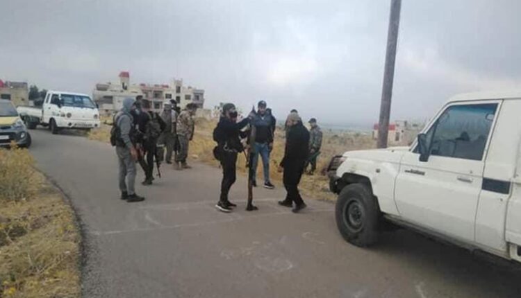 Members of a local faction besiege the headquarters of an armed group affiliated with the government's Security Intelligence in a town north of Suwayda