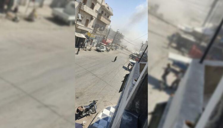 Smoke rising from the city of al-Bab during shelling