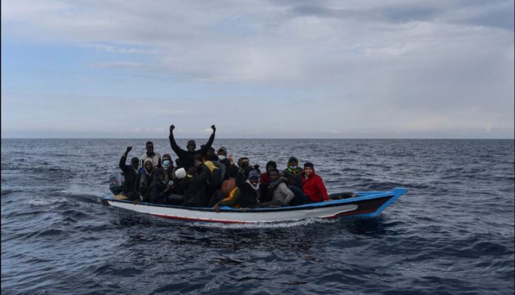 Migrants in a wooden boat are waiting to be rescued by a ship from the Spanish NGO Open Arms in the Mediterranean Sea off the coast of Libya, March 5, 2022 – AP Photo
