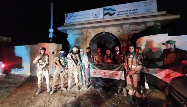 Militants of Hayat Thaeroon for Liberation in front of Defense Ministry of Syrian National Army in Afrin