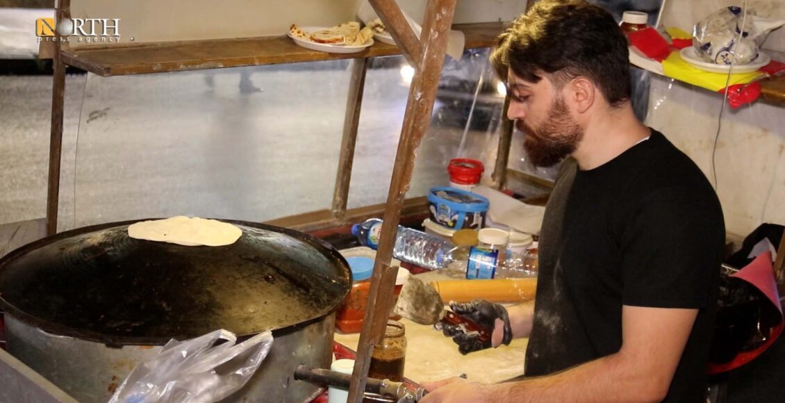 Eyli Issa, Syrian refugee, sells manakish on his carriage in Erbil – North Press