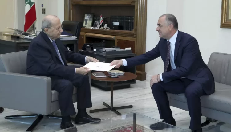 Lebanese President Michel Aoun, receives the final draft of the maritime border agreement between Lebanon and Israel from Lebanese Deputy Prime Minister Elias Bou Saab, who leads the Lebanese negotiating team, in Beirut – AP