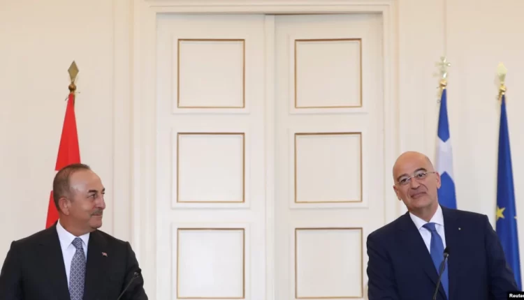 Greek Foreign Minister Nikos Dendias and his Turkish counterpart Mevlut Cavusoglu attend a news conference at the Ministry of Foreign Affairs in Athens, Greece, May 31, 2021.