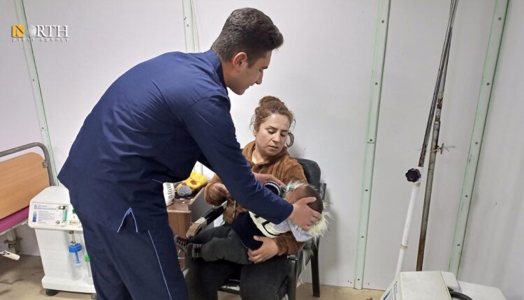 A child being sprayed in the hospital of Tel Rifaat in the northern countryside of Aleppo- North Press