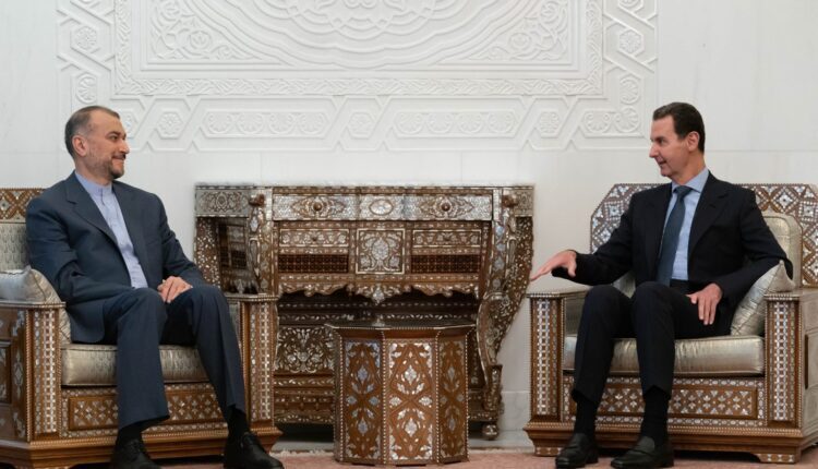 Syrian President Bashar al-Assad with Iran's Foreign Minister Hossein Amir Abdollahian