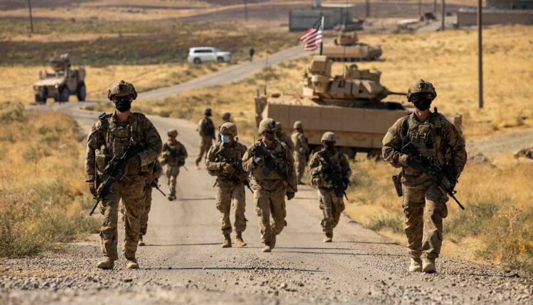 US troops accompanied by Bradley fighting vehicles in northeast Syria