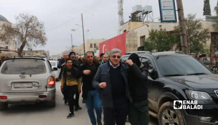Protesters, rejecting Syrian-Turkish normalization, expelling president of opposition Syrian National Coalition (SNC) in Azaz in Aleppo northern countryside