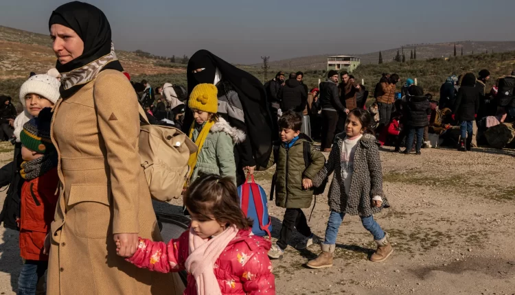 Syrians waiting to cross back into Syria from Turkey, where many of them lost homes in the Feb. 6 earthquake – NYT
