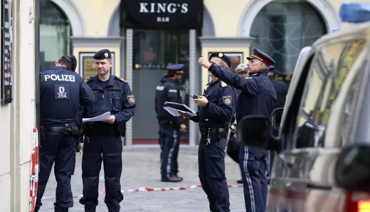 Police officers investigate the scene in Vienna – AP