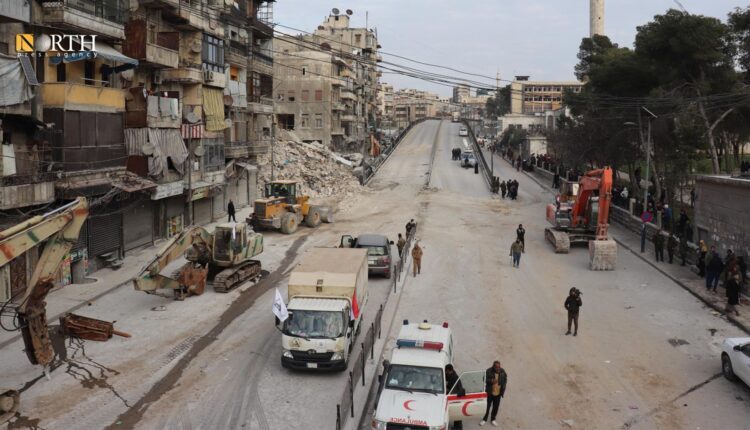 Vehicles of Iraq's Popular Mobilization Forces working on moving debris of collapsed buildings in Maysaloun neighborhood in Aleppo – North Press