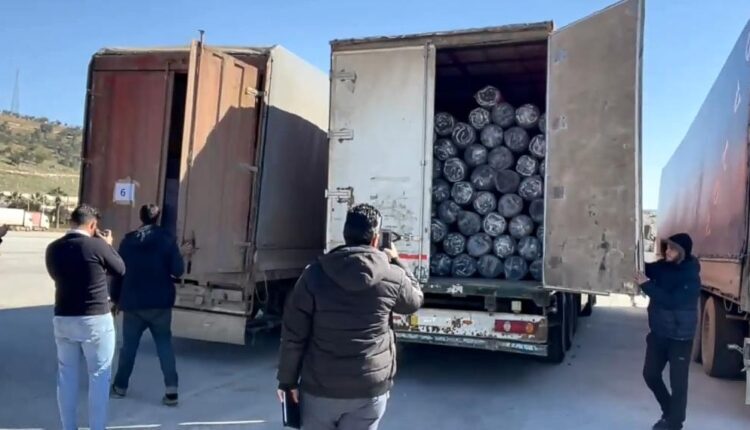 UN trucks arrive at the Bab al-Hawa bordering crossing between Turkey and NW Syria on Feb. 9, as part of previous aid programs