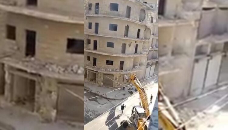 Three workers fell from an excavator preparing to demolish a cracked building after earthquake in Qadi Askar neighborhood in Aleppo city.