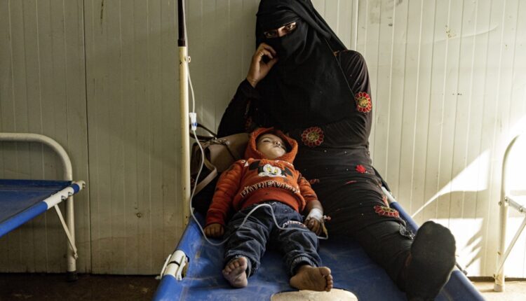 A mother and her child who was diagnosed with cholera in a hospital in Deir ez-Zor, Syria, Thursday, September 29, 2022. (AP Photo/Baderkhan Ahmad)