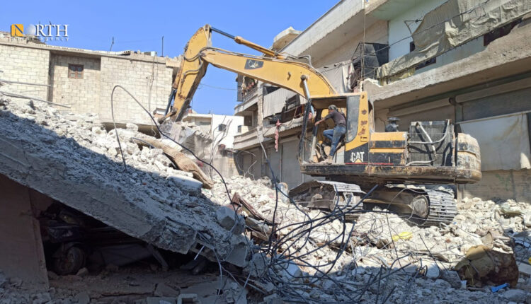 Excavator removing the rubble of a building devastated in the Feb. 6 quake in the town of Jindires of Afrin countryside, northwestern Syria, on April 10, 2023 – North Press