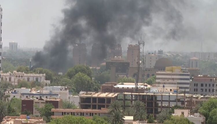 Heavy smoke bellows above buildings in the center of Khartoum due to the clashes between the army and the Rapid Support Forces