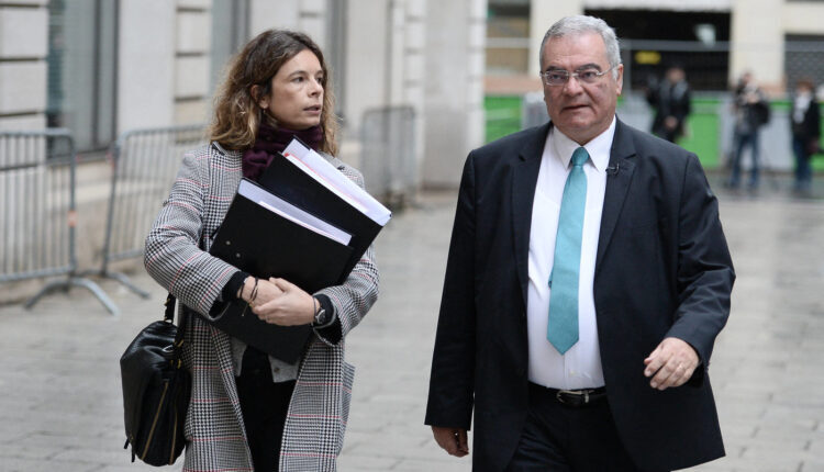 Clémence Bectarte, lawyer to the two men who disappeared, is flanked by Mazzen’s brother Obeida Dabbagh as she arrives at a Paris courthouse in 2016 – AFP