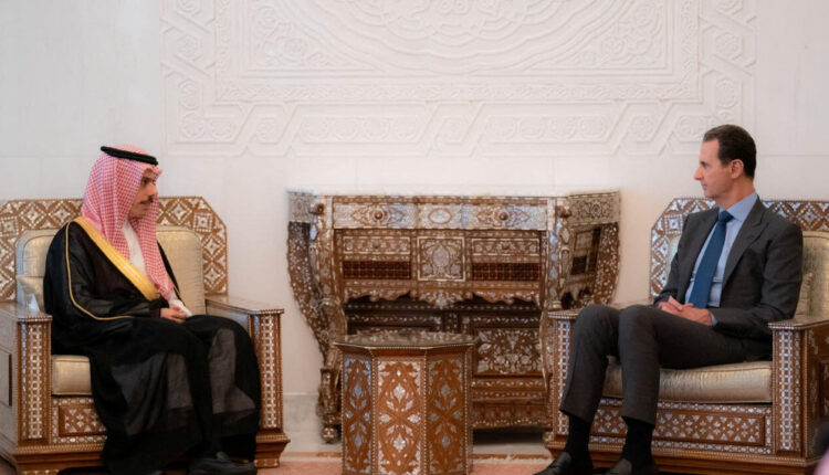 Syrian President Bashar al-Assad and Saudi Foreign Minister Faisal bin Farhan in the People’s Palace in the Syrian capital of Damascus