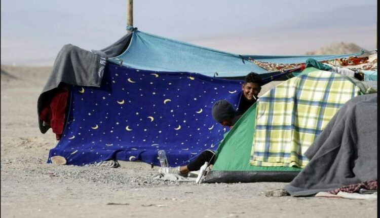 Undocumented migrants spend time in makeshift tents while stuck in Chile, after Peru refused to open its borders to migrants - Reuters