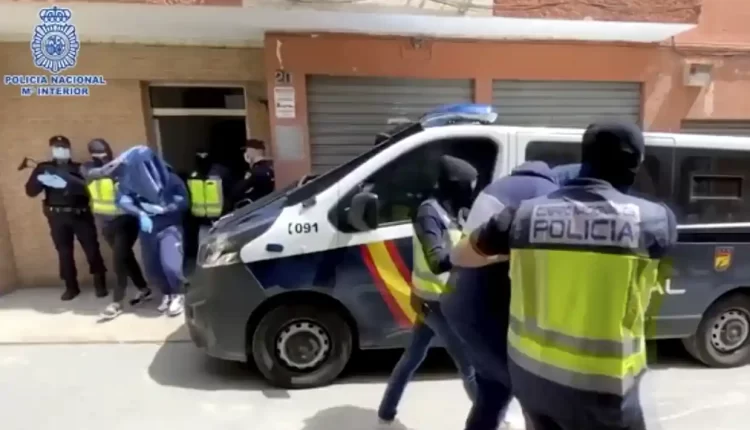 Photo caption: Spanish police escorting suspected ISIS extremists including Abdel Majed Abdel Bary in 2020 - Spanish National Police/AP