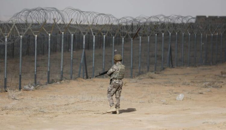 An Iraqi soldier patrols the Iraqi border with Syria in January 2023 - Reuters