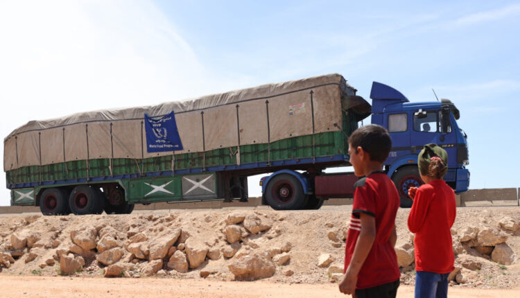 A truck delivering aid from the World Food Program passes to Syria – AFP