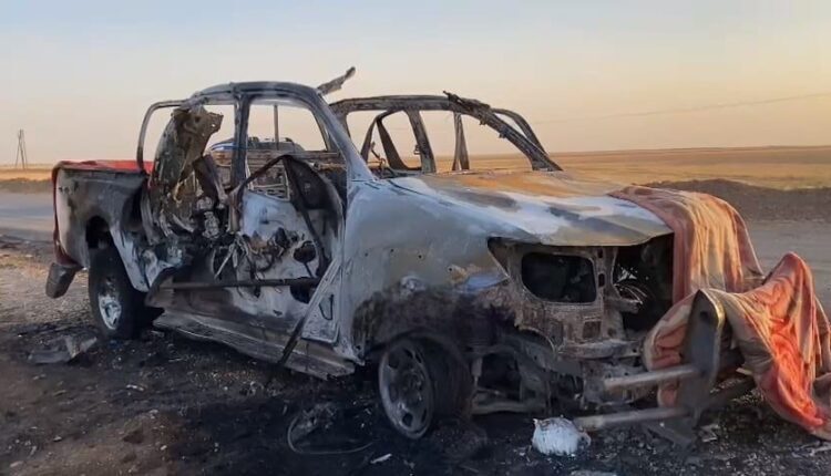 A vehicle struck by a Turkish drone in the countryside of the city of Qamishli in northeast Syria on July 27, 2023
