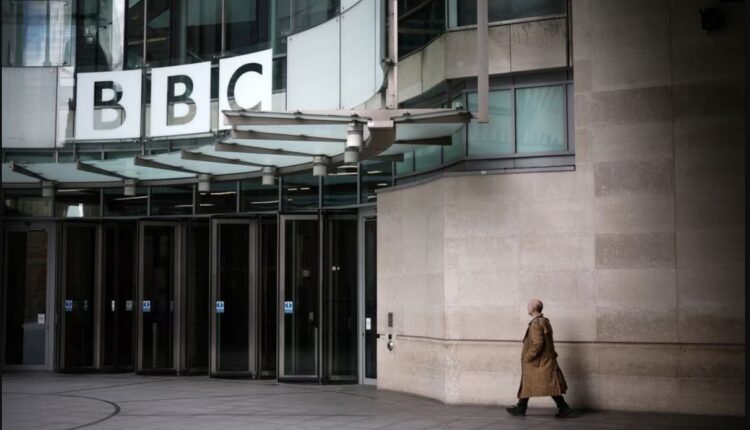 A person walks outside the BBC headquarters in central London, Britain, March 11, 2023 – Reuters