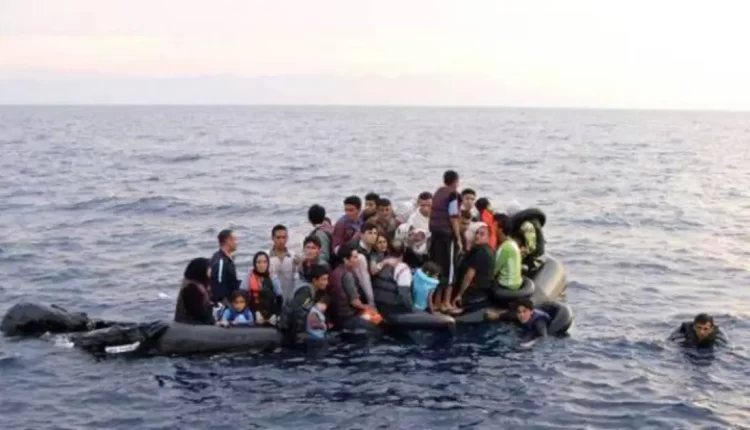 Undocumented immigrants on a rubber boat in the Aegean Sea – Reuters