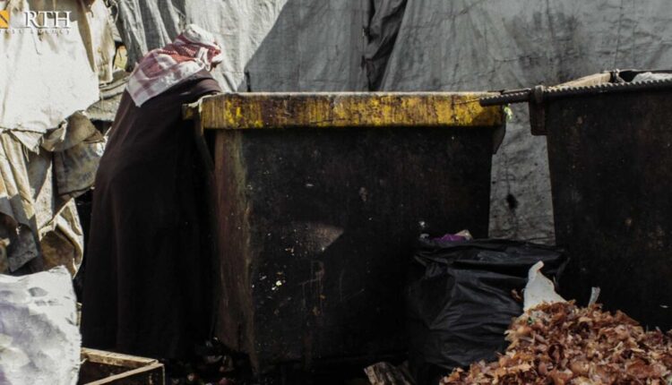 A man picking waste in a garbage container in the Syrian capital of Damascus – North Press