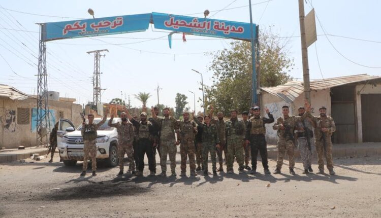 Fighters of the Syrian Democratic Forces (SDF) at the entrance of the town of Shuhail in the east of Deir ez-Zor, eastern Syria – SDF