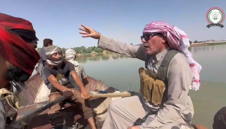 Hashem al-Sattam, the commander of the Iranian-backed Usud al-Uqaydat militia, along with militants crossing to areas east of the Euphrates River in Deir ez-Zor Governorate, eastern Syria, to fight the Syrian Democratic Forces (SDF)