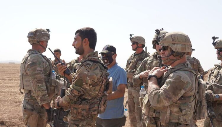 Muhammad Shibli and US soldiers during a joint patrol in NE Syria.