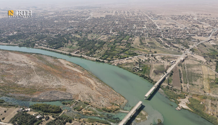An aerial photo showing the bridge and the town of Abu Kamal near the border with Iraq in eastern Syria – North Press