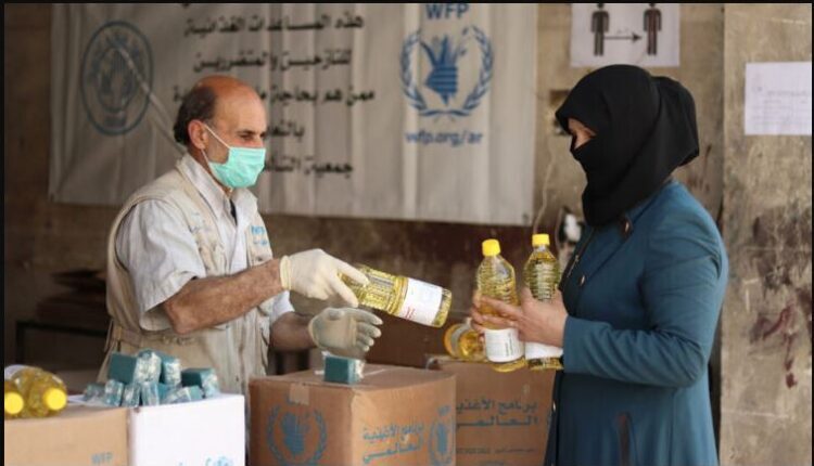 The World Food Program (WFP) distributes food aid to those in need in Raqqa, northeast Syria - North Press