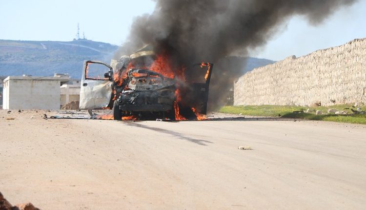 A car on fire after being targeted by a one-way drone attack of the Syrian government forces in Idlib Governorate, northwestern Syria