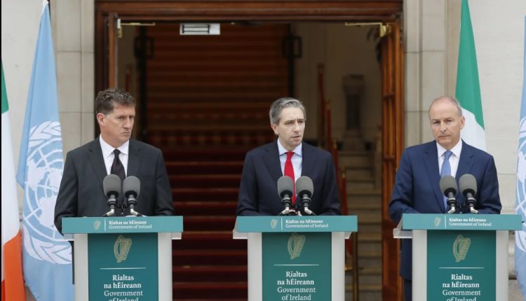 The three Irish Government leaders from left, Minister Eamon Ryan, Taoiseach Simon Harris and Tanaiste Micheal Martin speak to the media during a press conference outside the Government Buildings, in Dublin, Ireland, on May 22, 2024 - AP