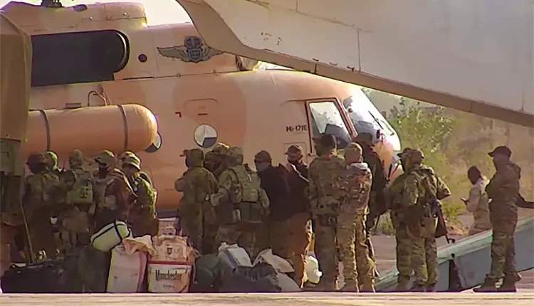 This undated photograph handed out by the French military shows Russian mercenaries boarding a helicopter in northern Mali - AP
