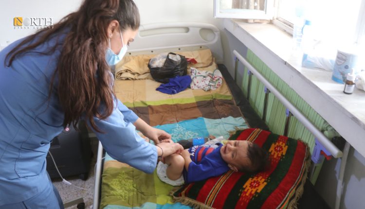 A nurse taking care of a child who was hospitalized due to water contamination in Hasakah city, NE Syria, June 11, 2024 – North Press