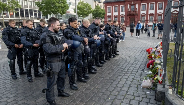 German police officers commemorate a colleague in Mannheim after he was stabbed and then died on June 2, 2024 – AP