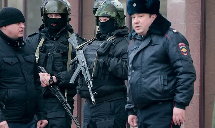 Police officers guard a court building in a town of Donetsk in Russia, March 22, 2016 - AP