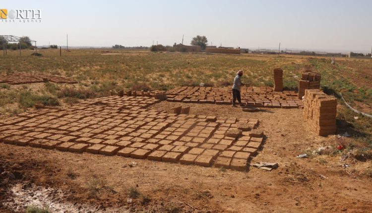 A man makes mud bricks to build a house in the countryside of Hasakah in northeastern Syria – North Press