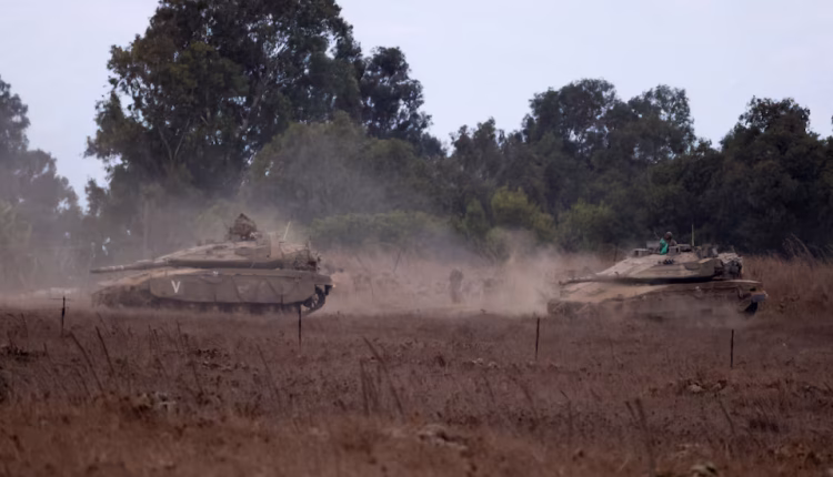 Israeli tanks are being moved, amid cross-border hostilities between Hezbollah and Israel, in the Israeli-occupied Golan Heights, southwestern Syria, Sep. 22, 2024 –Reuters