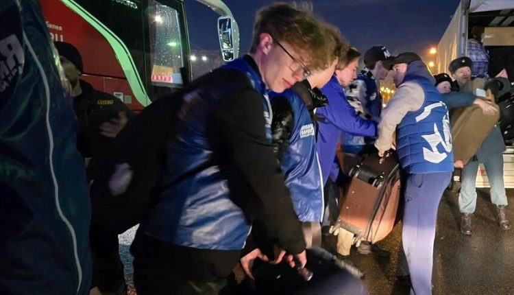 Russian citizens receive Syrian refugees evacuated from Hmeimim Airbase, April 2025.
