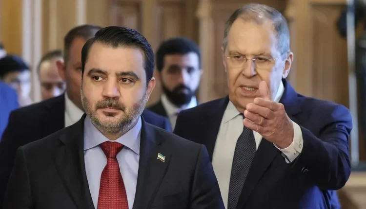 Russian Foreign Minister Sergei Lavrov shows the way to Syrian Foreign Minister Asaad al-Shaibani during a meeting in Moscow, Russia, on July 31, 2025 – Reuters