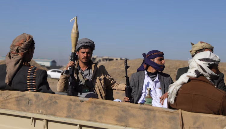 Iran-backed Houthi militants in a truck – Reuters